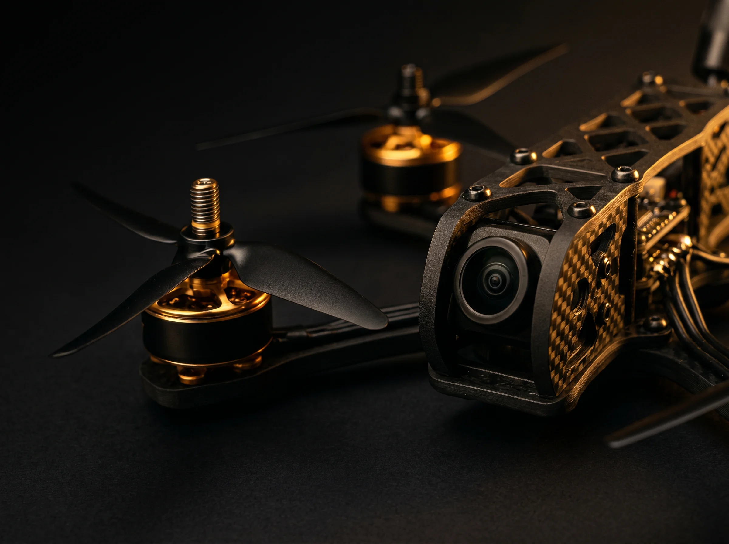 Sunchaser drone close-up showing gold motors, props, and FPV camera